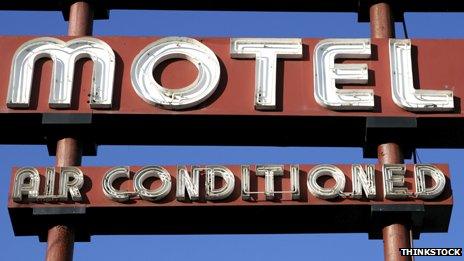 A motel sign saying "Air conditioned" below