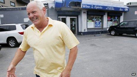 Stephen Rakes smiles after greeting an acquaintance outside the liquor store he once owned in the South Boston neighbourhood of Boston 6 June 2013