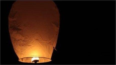 Sky lantern in a night sky