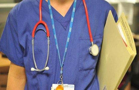 A woman doctor in scrubs