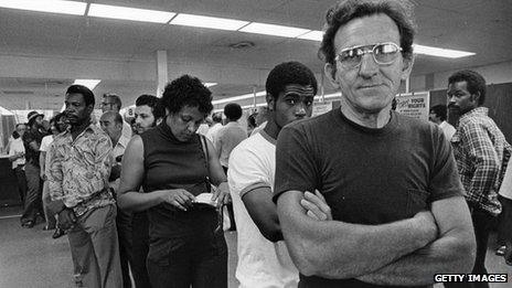 Unemployed autoworkers queuing at an unemployment office in Detroit, Michigan. Undated pic