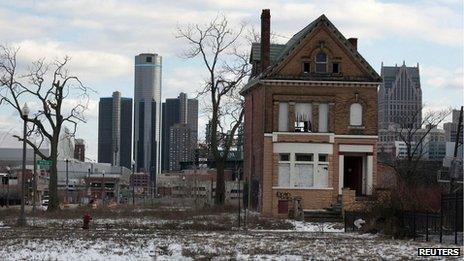 A boarded-up house is seen with the Detroit's city-centre skyline behind it. File photo from March 2013