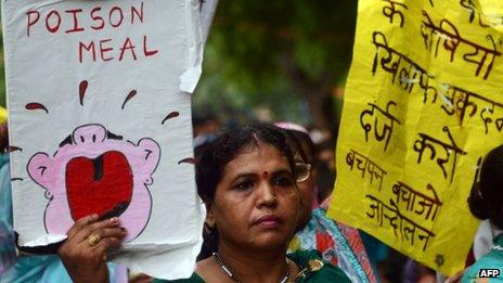 Indian children and activists shout anti-government slogans as they march to parliament in New Delhi demonstrating against the deaths of 23 children in Bihar state after they ate poisoned food, 20 July 2013