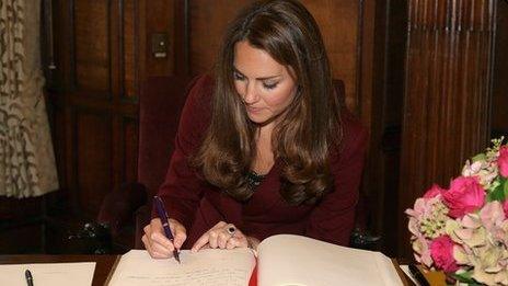 Duchess of Cambridge signing book