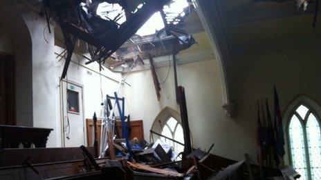 Hole in church roof caused by lightning strike