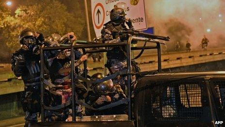 Security forces on patrol near the Guanabara Palace in Rio on 22 July 2013