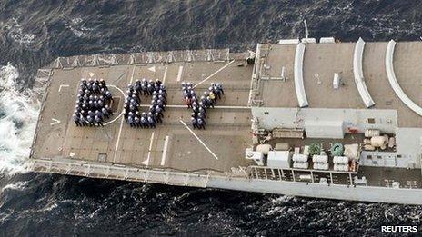 The ship's company of the Royal Navy frigate HMS Lancaster forms the word "BOY" on the aft deck to mark the birth of Britain's new prince while on patrol in the Caribbean