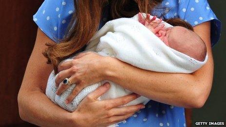 The Duchess of Cambridge holds her baby son