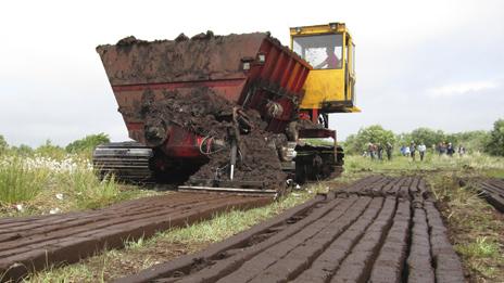 Irish turf-cutting machine in Monivea, Co Galway