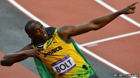 Jamaica's Usain Bolt celebrates after winning the men's 100m final