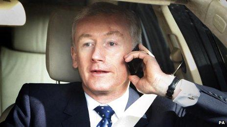 Fred Goodwin talking on the phone in a car