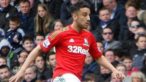 Neil Taylor playing for Swansea on his return from injury