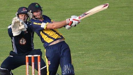 Chris Cooke hits a four against Northants