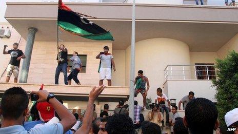 Libyan protesters attack the offices of Muslim Brotherhood-backed Party of Justice and Construction in the Libyan capital Tripoli on 27 July, 2013