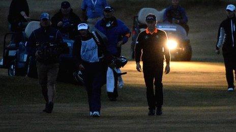 Bernhard Langer and Mark Wiebe walk down the fairway on the second hole of their play-off