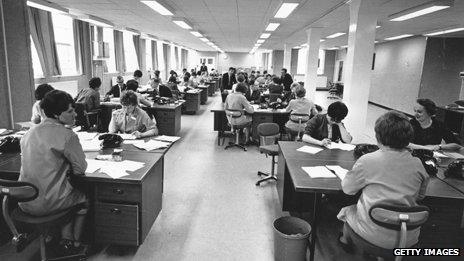 Mainly women sitting at desk in an open-plan office, 1966