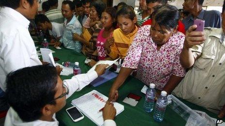 Supporters of the opposition Cambodian National Rescue Party gather to give their thumbprint as they complain that their names were not in the voting lists in 28 July election, during a public forum on the topic of the election of 28 July, at the party's office in Phnom Penh, Cambodia, 31 July 2013