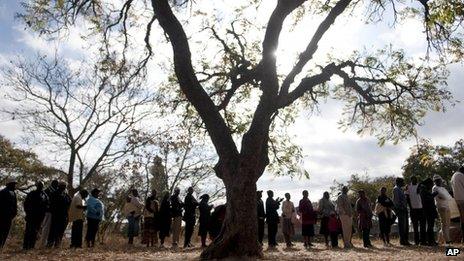 Zimbabweans queue to cast their votes in the country's general elections in Goromonzi, rural Zimbabwe Wednesday 31 July 2013