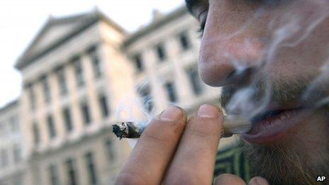 A man smokes marijuana outside the Uruguayan Congress on 31 July, 2013