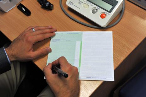 Doctor writing out a prescription