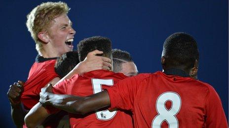 A delighted Oliver McBurney celebrates after scoring the late winner