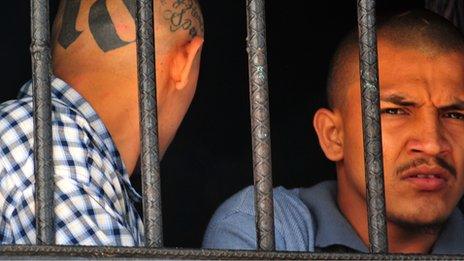 Inmates behind bars at the prison of San Pedro Sula in Honduras