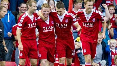 Jonny Hayes celebrates opening the scoring