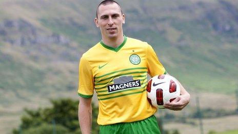 Celtic captain Scott Brown models the team's new away kit