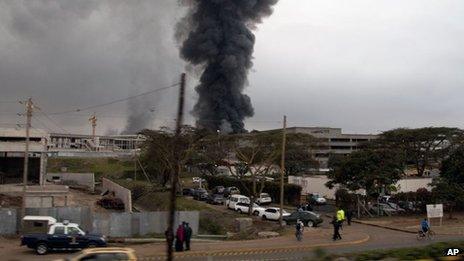 Dark smoke rises from the Jomo Kenyatta International Airport in Nairobi, Kenya, on Wednesday