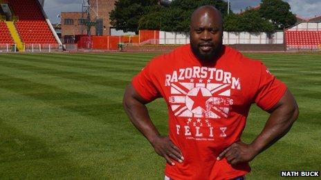 Mark Felix standing with hands on hips on a football pitch