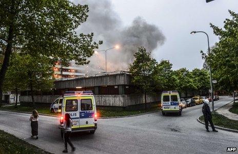 Police secure an area of Husby, Stockholm, during rioting, 20 May