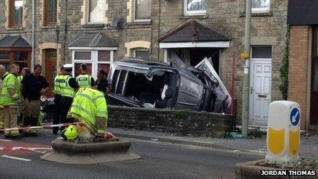 car crashes into house