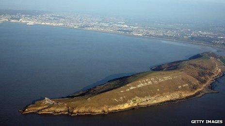 A headland juts out into the Severn Estuary