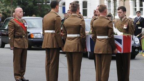 The coffin carrying Lance Corporal Craig Roberts is carried out of Holy Trinity Church, Llandudno, after his funeral.