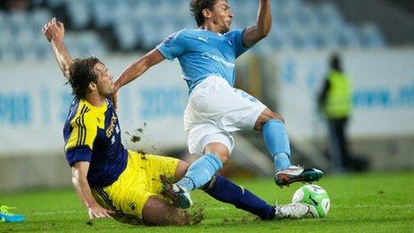 Swansea's Michu fouls Ricardinho