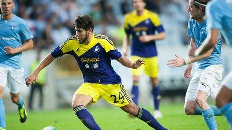 Swansea's Alejandro Pozuelo takes on the Malmo defence