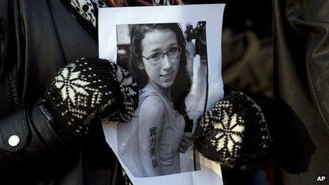 A mourner holds a photograph of Rehtaeh Parsons (April 2013)