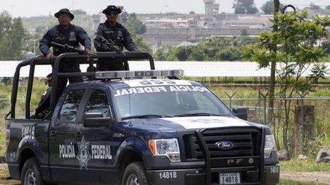 Mexican Federal Police officers patrol the surroundings of the Puente Grande State prison where former top Mexican cartel boss Rafael Caro Quintero has been imprisoned