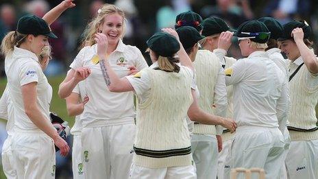 Australia celebrate a wicket by Holly Ferling