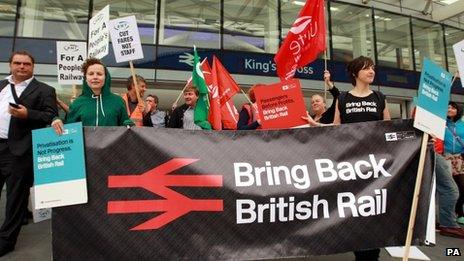 Campaigners with a 'bring back British Rail banner' at King's Cross station