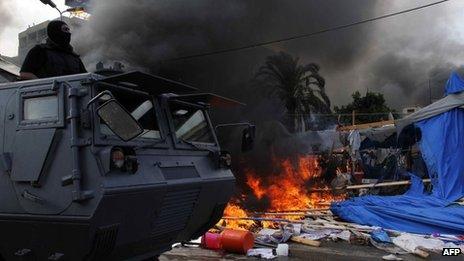 Egyptian security forces move in to disperse a protest camp held by supporters of ousted president Mohamed Morsi (16 August 2013)