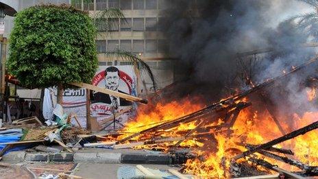 A fire rages after security forces cleared a pro-Morsi protest camp in Nahda Square