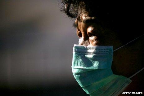 A man in Hong Kong wearing a mask to protect him from Sars