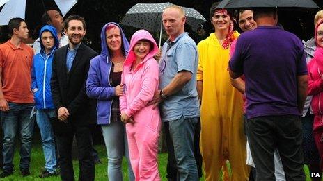 People in onesies outside the church