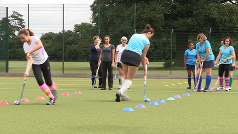 Girls playing hockey