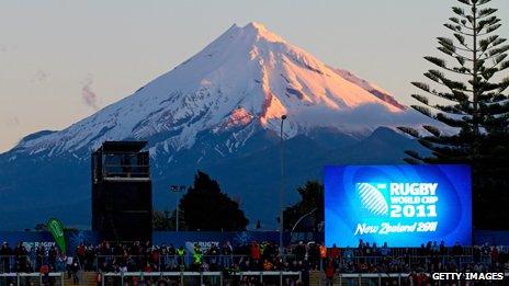 Mt Taranaki behind a big screen showing a match in 2011's Rugby World Cup