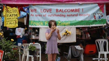 Protester eats as she continues her protest