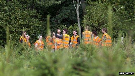 Legal observers gather at the site