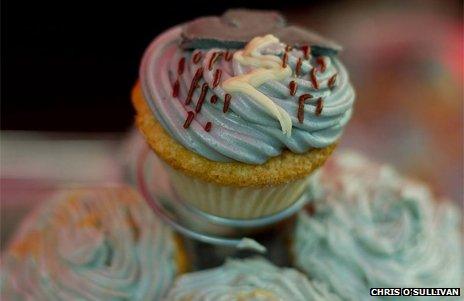 Grey cupcake decorated with rainclouds