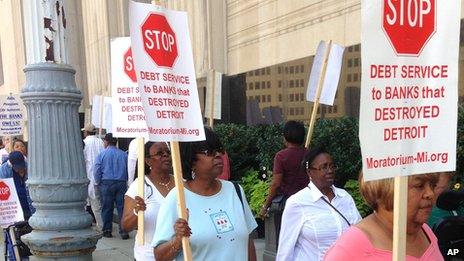 Pensioners picket outside the federal court in Detroit on 19 August 2013